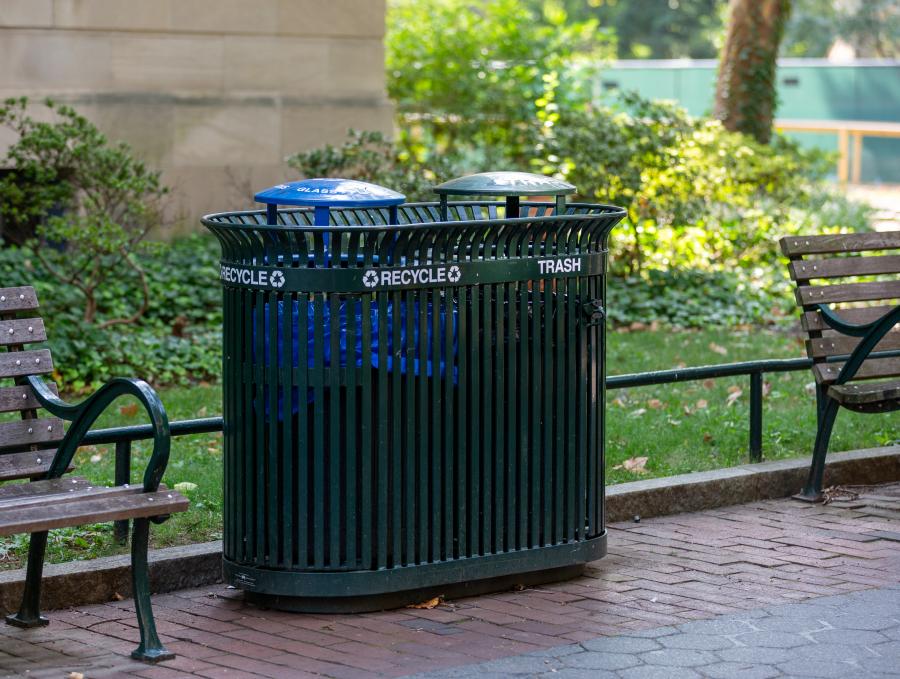 Green metal slatted trash and recycling cans on 36th Street Walk