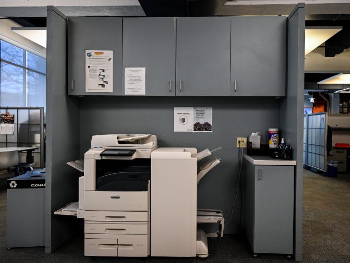 An office printer and cabinets