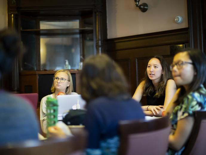 People sitting around a table talking