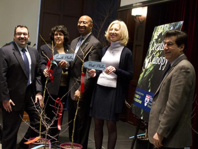 Amy Gutmann and other Penn leaders holding the free trees