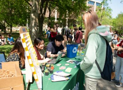 Earth Week 2023 Table with Penn folks chatting