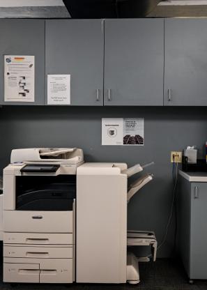 An office printer and cabinets