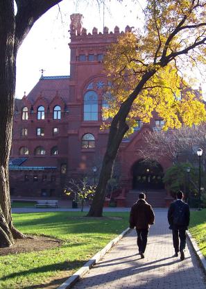 People walking on path towards building